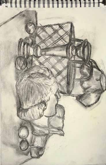Charcoal still life with bottles, basket, and fruit.